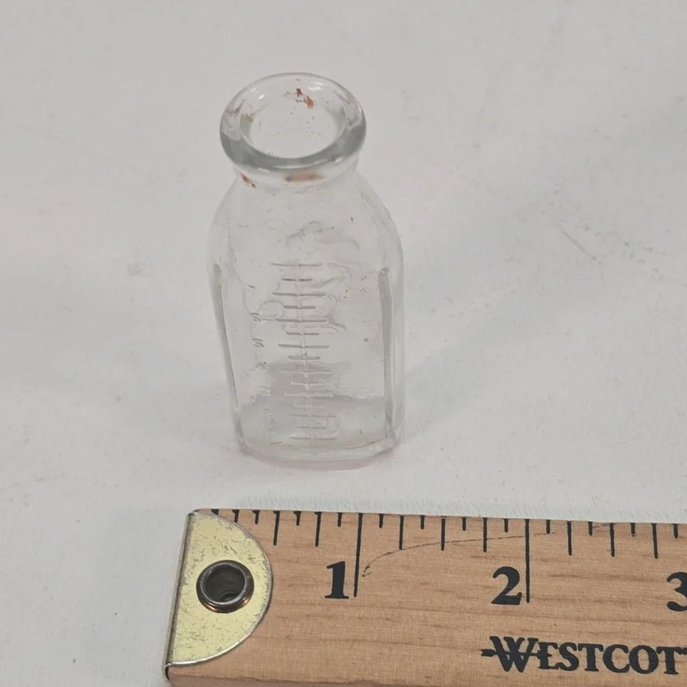 Vintage Glass Baby Doll Bottle Embossed Dog Wetting toy